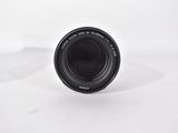 an image of a camera lens sitting on top of a white surface