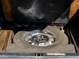 a black stove with a metal burner inside of it