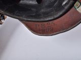a close up of a person ' s hand holding a shoe