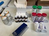 a table with a variety of bottles and containers on it