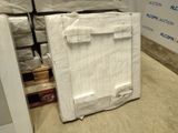boxes of mattresses are stacked on top of each other in a warehouse