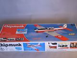 the box is open to show the model of a small airplane