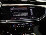 the interior of a car with a touch screen and a steering wheel