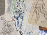 several drawings of a man sitting on a chair next to a pile of papers