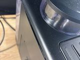a black stove top with a black burner on it