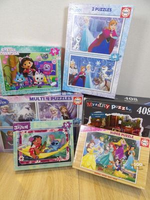 a lot of puzzles on the table together