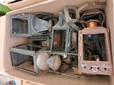 a cardboard box filled with old appliances and other items