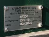 a close up of a sign on a green door