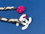 a pair of scissors and a chain on a blue surface