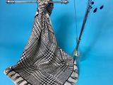 an image of a scarf hanging on a clothes rack