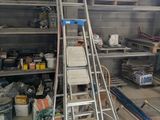 a ladder that is leaning against a wall in a garage
