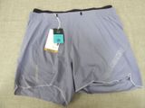 the shorts are gray and black with a tag on it
