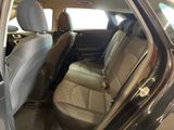 the back seats of a car are empty and the passenger seat is empty