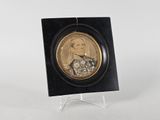 a picture of a gold coin with a picture of a man on it