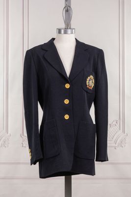 navy blue blazer with gold buttons on a mannequin base