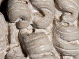 a close up of a sculpture of a man with a snake