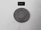 a close up of a coin on a white surface
