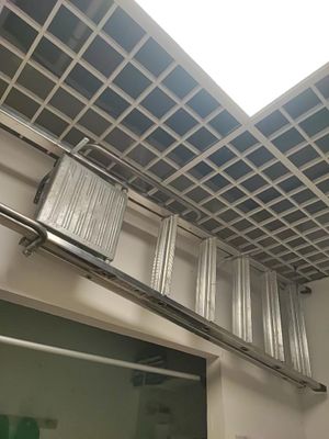 a ladder that is hanging from the ceiling in the bathroom