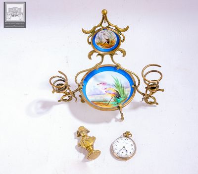 a clock with a picture of a fish on it hanging from a wall