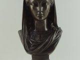 bronze bust of a woman with a veil on her head