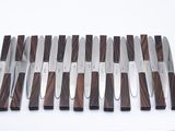 a lot of knives that are sitting on a table