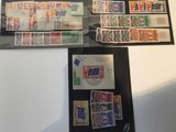 several different stamps are displayed in a display case on a table