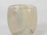 an image of a close up of a glass cup on a white surface