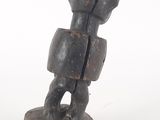 an image of a statue of a man holding a bag