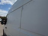a white van that is parked in a parking lot