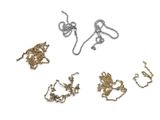 four different types of necklaces on a white surface