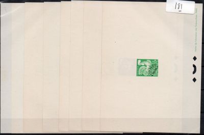 an old photo of a green stamp on a piece of paper