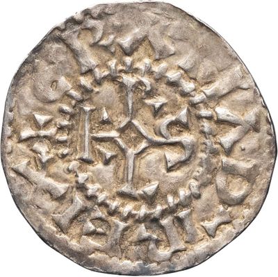 une pièce d'argent sur laquelle figure l'image d'un cheval et de son cavalier