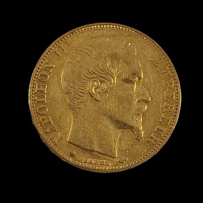 l'image d'une pièce d'or sur laquelle figure le visage d'un homme