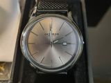 a watch that is sitting in a box on a table