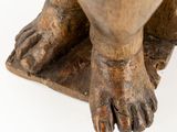 an image of a statue of a cat with its paw on the ground
