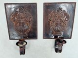pair of antique cast iron wall sconces with flower vases