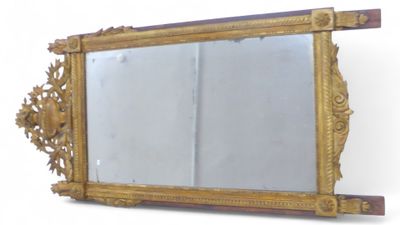 a mirror that is sitting on the wall