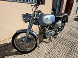 a motorcycle that is parked on the side of the street