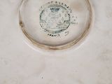 a white plate with a black and white design on it