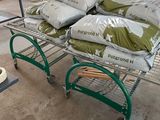 many bags of food on a cart in a store