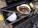a hard hat sitting on top of a black box