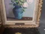 a painting of flowers in a blue vase on a table