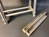 a metal rack with a pair of scissors next to it