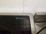 a microwave that is sitting on a counter in a kitchen