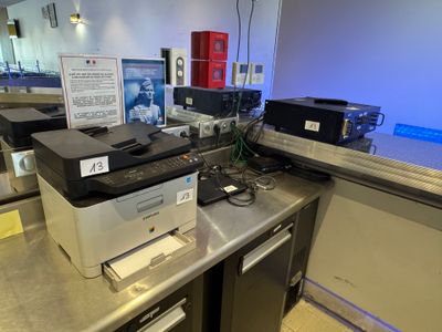 a photo of a printer and other electronics on a counter