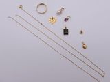 an assortment of jewellery including a necklace, ring, and earrings