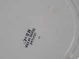 a white plate with a black writing on it