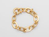 an image of a gold bracelet on a white background