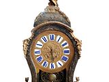 a clock with a statue on top of it on a white background