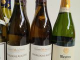several bottles of wine are lined up on a table
